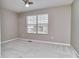 Neutral bedroom features a ceiling fan, window, and plush carpeting for a comfortable living space at 13499 Molique Blvd, Fishers, IN 46037