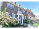 Beautiful brick townhome boasts a well-manicured front yard and welcoming entrance at 13499 Molique Blvd, Fishers, IN 46037