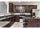 Well-equipped kitchen features stainless steel appliances, granite countertops, and ample cabinet space at 13499 Molique Blvd, Fishers, IN 46037