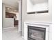 Bright living room with fireplace, staircase, and a partial view of the kitchen at 13499 Molique Blvd, Fishers, IN 46037