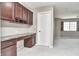 Home office features a built in desk, drawer space, overhead cabinets, and carpeted floors at 13499 Molique Blvd, Fishers, IN 46037