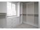 Custom walk-in closet with built-in shelving and drawers at 13499 Molique Blvd, Fishers, IN 46037