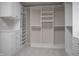 Custom walk-in closet with multiple shelving and drawer units at 13499 Molique Blvd, Fishers, IN 46037
