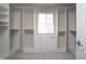 Spacious walk-in closet with custom shelving and a window at 13499 Molique Blvd, Fishers, IN 46037
