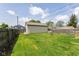 Fenced backyard featuring a detached garage and grass at 1426 S Anderson St, Elwood, IN 46036