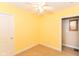 Bedroom featuring neutral walls, ceiling fan, and large window at 1426 S Anderson St, Elwood, IN 46036