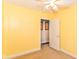 Bedroom featuring neutral walls, ceiling fan, and large window at 1426 S Anderson St, Elwood, IN 46036
