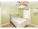 Inviting bedroom with neutral carpet, ceiling fan, and a comfortable bed at 1426 S Anderson St, Elwood, IN 46036