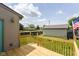 Home features a wooden deck with a grassy lawn and a detached garage at 1426 S Anderson St, Elwood, IN 46036