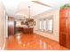 Inviting dining room features hardwood floors, large windows, and access to a well-appointed kitchen at 1426 S Anderson St, Elwood, IN 46036