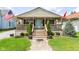 Charming home featuring a welcoming front porch, well-maintained lawn, and tidy landscaping at 1426 S Anderson St, Elwood, IN 46036