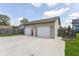 Garage features a concrete driveway and two garage doors at 1426 S Anderson St, Elwood, IN 46036