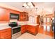 Efficient kitchen featuring stainless steel appliances, ample cabinet space, and modern countertops at 1426 S Anderson St, Elwood, IN 46036