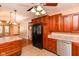 Traditional kitchen featuring wood cabinets, granite countertops, and stainless steel dishwasher at 1426 S Anderson St, Elwood, IN 46036
