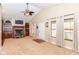 Bright living room with a fireplace, built-in shelving, vaulted ceilings and many windows at 1426 S Anderson St, Elwood, IN 46036