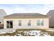 Backyard featuring vinyl siding, sliding glass door and windows with some snow on the ground at 15447 Gallow Ln, Noblesville, IN 46060