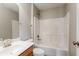 Bathroom showcasing bright white tub with modern hardware, vanity with sink, and a large mirror at 15447 Gallow Ln, Noblesville, IN 46060