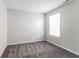 Bedroom with neutral walls, plush carpet, and window at 15447 Gallow Ln, Noblesville, IN 46060