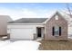 Charming single-Gathering home with brick accents, attached garage, and manicured lawn at 15447 Gallow Ln, Noblesville, IN 46060