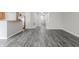 Spacious living area with hard surface floors leading to the kitchen and other rooms at 15447 Gallow Ln, Noblesville, IN 46060