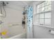 Bright bathroom showcasing a bathtub with shower, updated fixtures, and natural light at 155 N Franklin Rd, Indianapolis, IN 46219