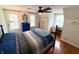 Charming bedroom with a ceiling fan, built in bookshelf, and bright natural light at 155 N Franklin Rd, Indianapolis, IN 46219