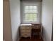 This desk area includes a vintage desk with natural light from the picture window at 155 N Franklin Rd, Indianapolis, IN 46219