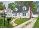 Classic home featuring a well-kept lawn and a paved walkway leading to the front entrance at 155 N Franklin Rd, Indianapolis, IN 46219