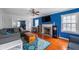 Cozy living room with a stone fireplace, hardwood floors, and plenty of natural light at 155 N Franklin Rd, Indianapolis, IN 46219