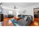 Inviting living room with hardwood floors, a sectional sofa, and an open layout at 155 N Franklin Rd, Indianapolis, IN 46219