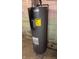 Image of a gray Professional water heater in the basement at 155 N Franklin Rd, Indianapolis, IN 46219