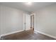 A bedroom has a small closet with mirrored doors and brown carpet at 1602 Villa Ave, Indianapolis, IN 46203