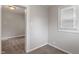 Neutral tones in this bedroom include paint and carpet, with natural light from one window at 1602 Villa Ave, Indianapolis, IN 46203