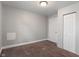 A basic bedroom with light gray walls, brown carpet, and a double door closet at 1602 Villa Ave, Indianapolis, IN 46203
