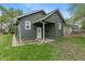 Charming home featuring green siding, white trim, and a covered front entry at 1602 Villa Ave, Indianapolis, IN 46203