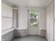 Sun room with window, painted brick detail, and access to front yard at 1602 Villa Ave, Indianapolis, IN 46203
