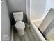 Close-up of a bathroom, featuring a white toilet and an alcove tub at 1715 S Madison St, Muncie, IN 47302