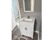 Bathroom features a modern vanity with a stylish sink and cabinet, providing a clean and functional space at 1715 S Madison St, Muncie, IN 47302