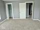 Bedroom with plush carpet flooring and a large closet, providing ample storage space and comfort at 1715 S Madison St, Muncie, IN 47302