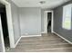 Bedroom featuring wood-look flooring, neutral-toned walls, closet at 1715 S Madison St, Muncie, IN 47302