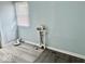 A well-lit laundry room features sleek vinyl flooring and modern plumbing, making laundry tasks efficient and convenient at 1715 S Madison St, Muncie, IN 47302