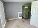 This room features carpet floors, with a window frame and other items for renovation and installation at 1715 S Madison St, Muncie, IN 47302