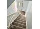 Carpeted staircase leading to a front door with stained glass at 1715 S Madison St, Muncie, IN 47302