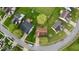 Aerial view showcasing the property's location within a residential neighborhood and lush greenery at 2154 Walnut Meadow Ct, Indianapolis, IN 46234
