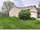 Well-maintained backyard with a lush lawn, privacy fence, and mature landscaping at 2154 Walnut Meadow Ct, Indianapolis, IN 46234