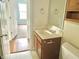 Modest bathroom featuring a vanity with sink, mirror, and standard toilet, suitable for a functional space at 2154 Walnut Meadow Ct, Indianapolis, IN 46234