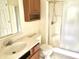 Cozy bathroom featuring a shower with glass doors and a wooden vanity at 2154 Walnut Meadow Ct, Indianapolis, IN 46234