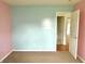 Comfortable bedroom featuring two-tone walls with neutral carpet and an entry to another room at 2154 Walnut Meadow Ct, Indianapolis, IN 46234