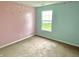 Bedroom with a window and walls painted in light blue and pink at 2154 Walnut Meadow Ct, Indianapolis, IN 46234