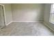 Tiled bedroom featuring neutral paint, a large window and a white door, creating a bright space at 2154 Walnut Meadow Ct, Indianapolis, IN 46234